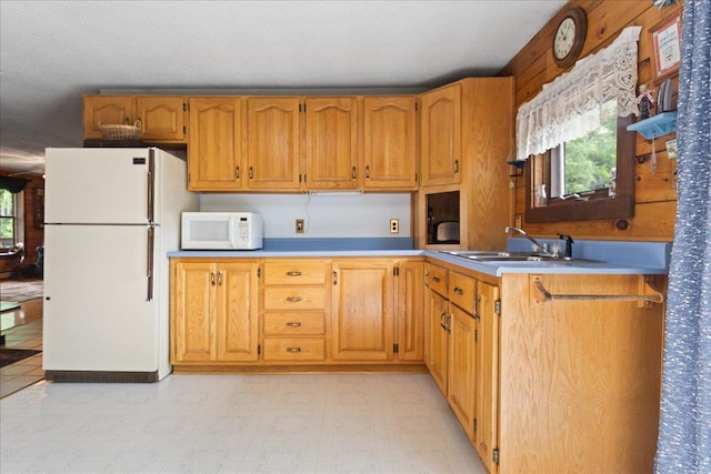 110 W Milan Rd, Milan, NH 03588 - kitchen featuring white appliances, plenty of natural light, light countertops, and brown cabinets