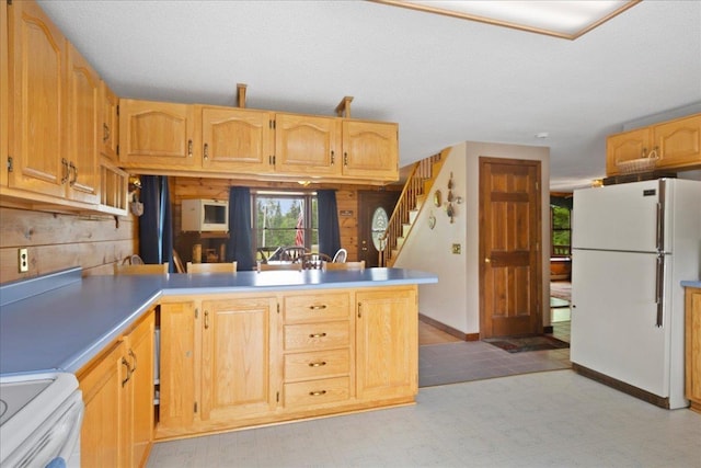 110 W Milan Rd, Milan, NH 03588 - kitchen featuring white appliances, a peninsula, and light countertops