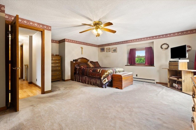 110 W Milan Rd, Milan, NH 03588 - carpeted bedroom featuring a baseboard heating unit, a ceiling fan, and a textured ceiling