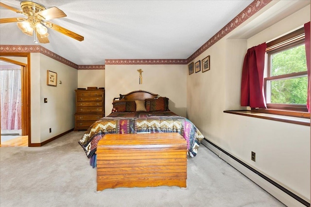 110 W Milan Rd, Milan, NH 03588 - bedroom with a baseboard radiator, carpet, and a ceiling fan