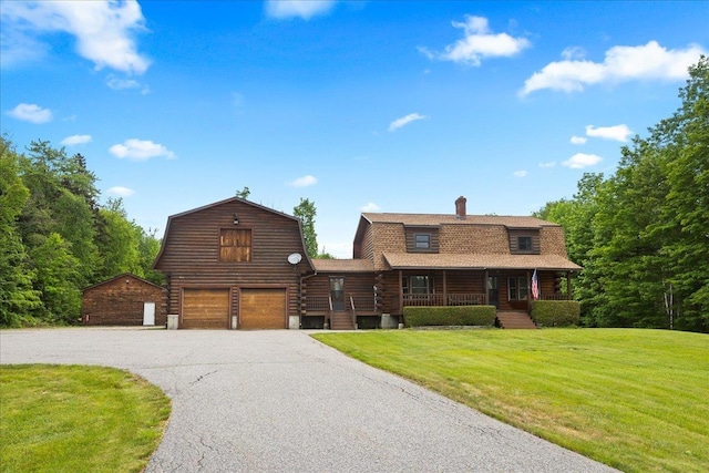 110 W Milan Rd, Milan, NH 03588 - cabin featuring a gambrel roof, asphalt driveway, a porch, and a front yard