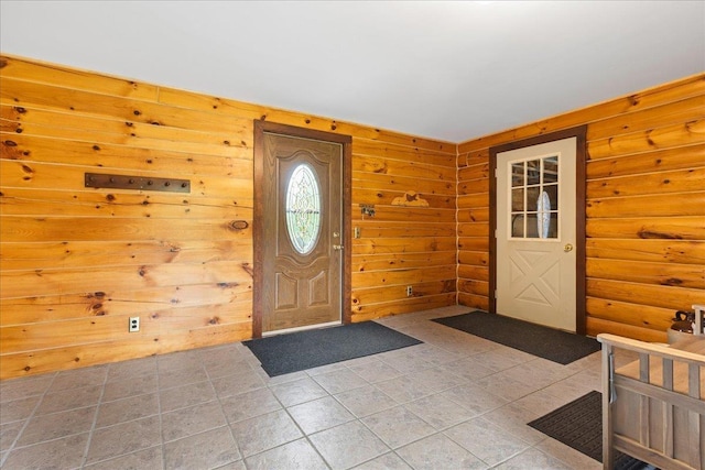 110 W Milan Rd, Milan, NH 03588 - foyer with light tile patterned floors and log walls