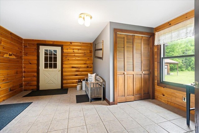 110 W Milan Rd, Milan, NH 03588 - entryway with light tile patterned floors and rustic walls