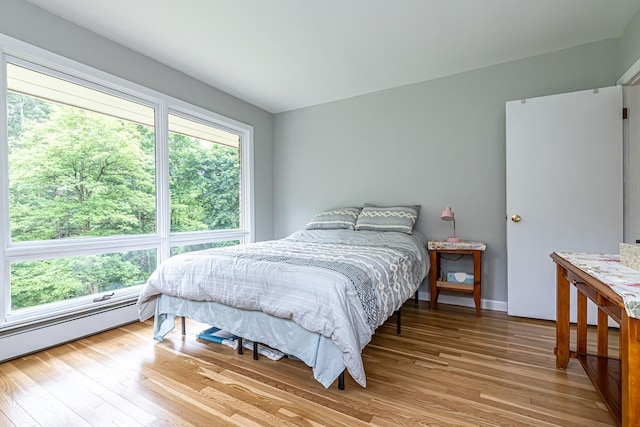 28 New Searles Rd, Nashua, NH 03062 - bedroom with light wood finished floors and baseboard heating