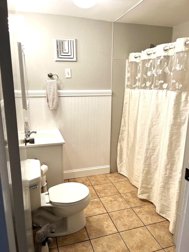 28 New Searles Rd, Nashua, NH 03062 - bathroom featuring wainscoting, tile patterned flooring, vanity, and a shower with curtain
