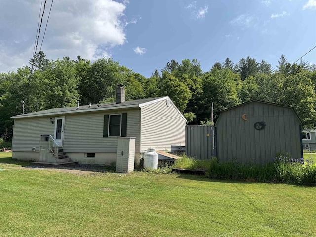 276 Minister Brook Rd, Worcester, VT 05682 - rear view of house with a yard, entry steps, and a chimney