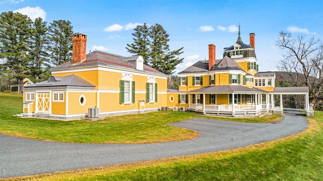 2 Croydon Brook Rd, Newport, NH 03773 - rear view of property with covered porch, a chimney, asphalt driveway, a carport, and a lawn
