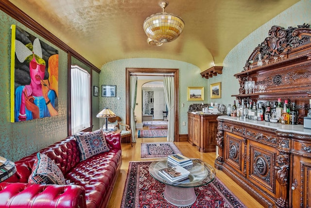 2 Croydon Brook Rd, Newport, NH 03773 - living area with light wood-style floors, bar, lofted ceiling, and arched walkways