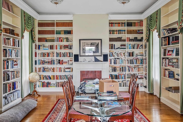 2 Croydon Brook Rd, Newport, NH 03773 - living area with bookshelves, wood finished floors, a tiled fireplace, and ornamental molding