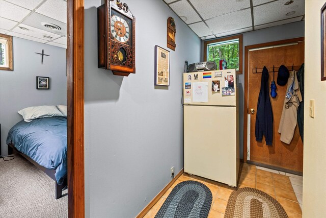 15 Milford St, Amherst, NH 03031 - hallway featuring a paneled ceiling and light tile patterned flooring