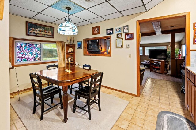 15 Milford St, Amherst, NH 03031 - dining room featuring healthy amount of natural light and light tile patterned floors
