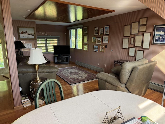 572 Stagecoach Rd, Fayston, VT 05673 - living area with a baseboard radiator and wood finished floors