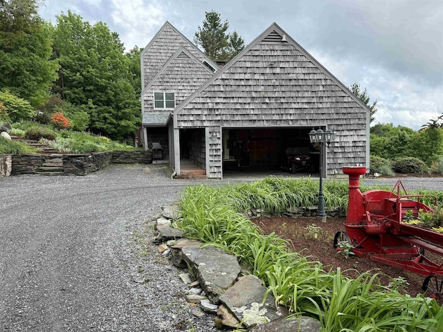 572 Stagecoach Rd, Fayston, VT 05673 - view of front facade featuring a garage and driveway