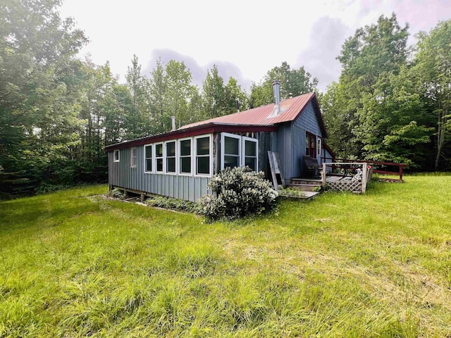 1533 Morey Rd, Sutton, VT 05867 - view of side of property with a yard, a metal roof, and a deck