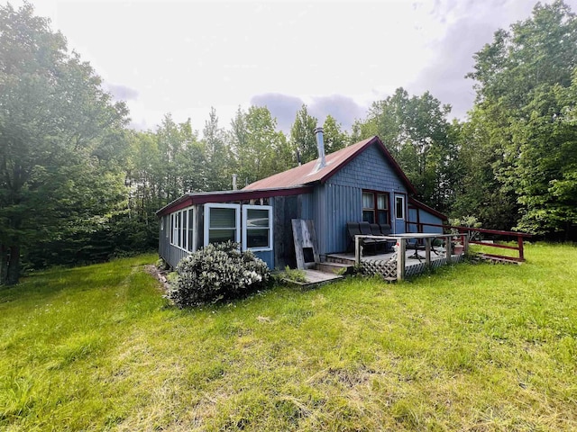 1533 Morey Rd, Sutton, VT 05867 - back of property featuring a wooden deck, a lawn, and a metal roof