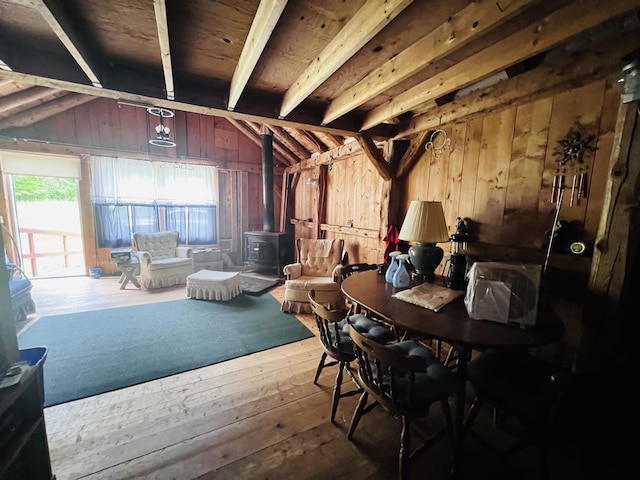 1533 Morey Rd, Sutton, VT 05867 - sitting room featuring a wood stove, lofted ceiling, hardwood / wood-style floors, and wood walls