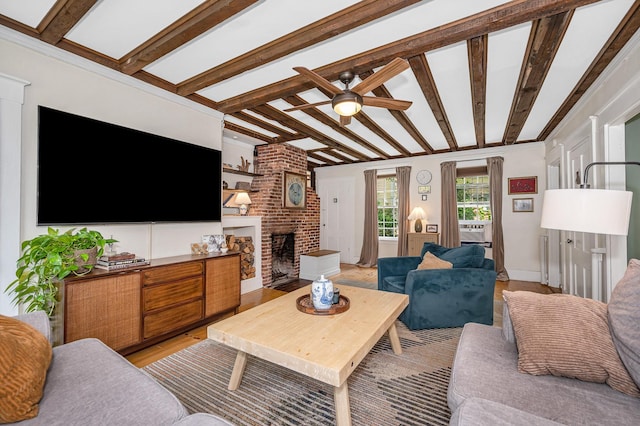 8 Main St, Brookline, NH 03033 - living area featuring ceiling fan, a fireplace, beam ceiling, and light wood-type flooring