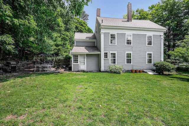 8 Main St, Brookline, NH 03033 - rear view of property featuring a patio area, a yard, and a chimney