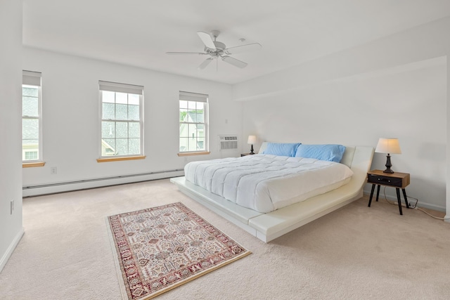 7 Shadow Brook Dr, Hanover, NH 03755 - carpeted bedroom featuring a baseboard heating unit, a wall mounted air conditioner, and a ceiling fan