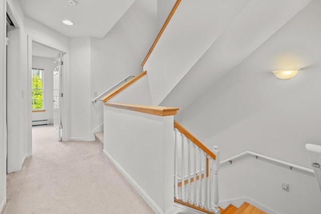 7 Shadow Brook Dr, Hanover, NH 03755 - hall featuring a baseboard heating unit, carpet, and an upstairs landing