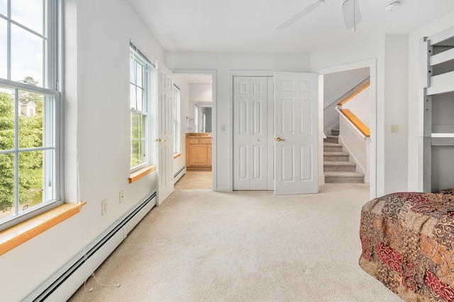 7 Shadow Brook Dr, Hanover, NH 03755 - bedroom featuring a baseboard radiator, light colored carpet, connected bathroom, and a closet