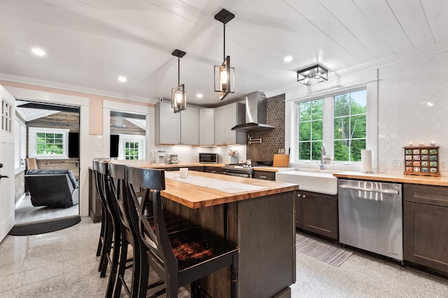 6 Rainbow Dr, Ossipee, NH 03864 - kitchen featuring appliances with stainless steel finishes, wall chimney exhaust hood, wood counters, ornamental molding, and a kitchen bar