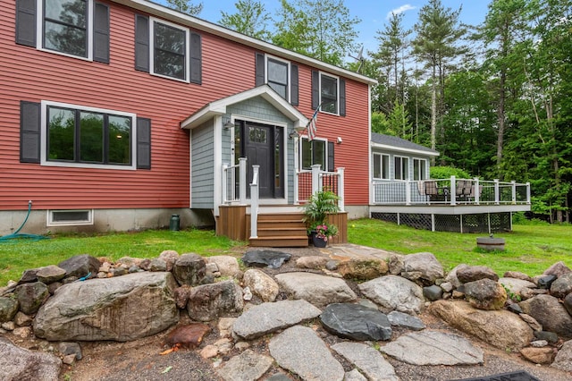 6 Rainbow Dr, Ossipee, NH 03864 - view of front of property with a deck and a front yard