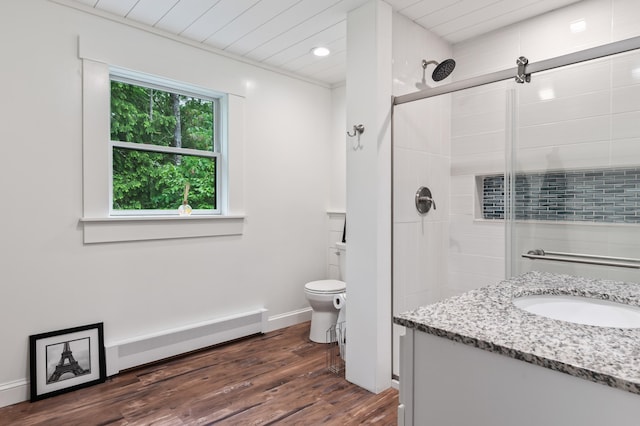 6 Rainbow Dr, Ossipee, NH 03864 - full bath featuring a baseboard radiator, a shower stall, wood finished floors, vanity, and recessed lighting