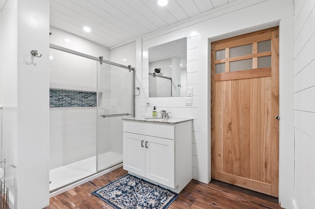 6 Rainbow Dr, Ossipee, NH 03864 - bathroom with a shower stall, vanity, wood finished floors, and recessed lighting