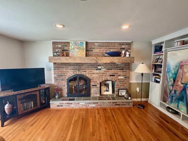 653 Skyboro E Rd, Pownal, VT 05261 - unfurnished living room with a brick fireplace, wood finished floors, and recessed lighting