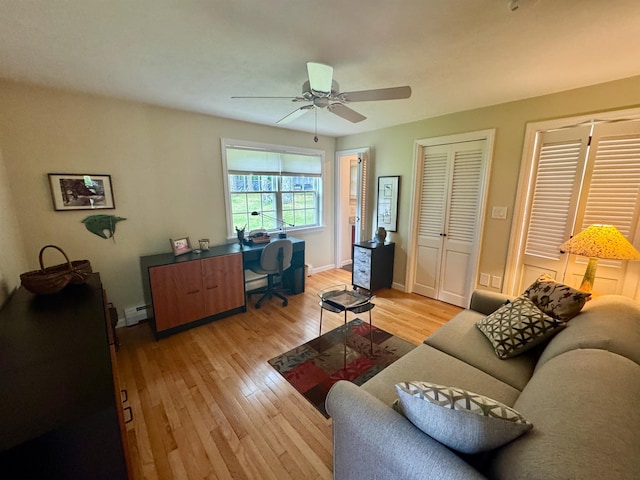 653 Skyboro E Rd, Pownal, VT 05261 - living area with light wood-style flooring, ceiling fan, and baseboard heating
