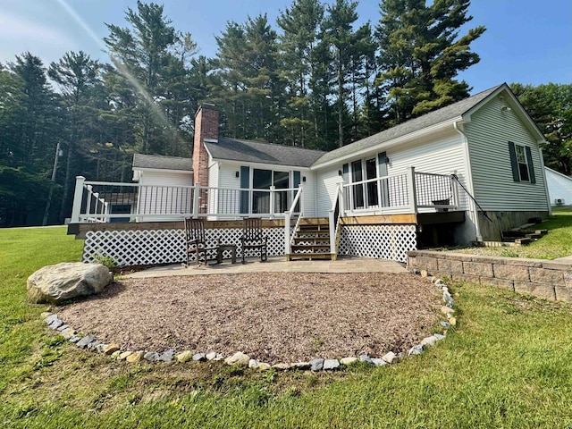 653 Skyboro E Rd, Pownal, VT 05261 - back of property featuring a wooden deck, a lawn, a chimney, and stairs
