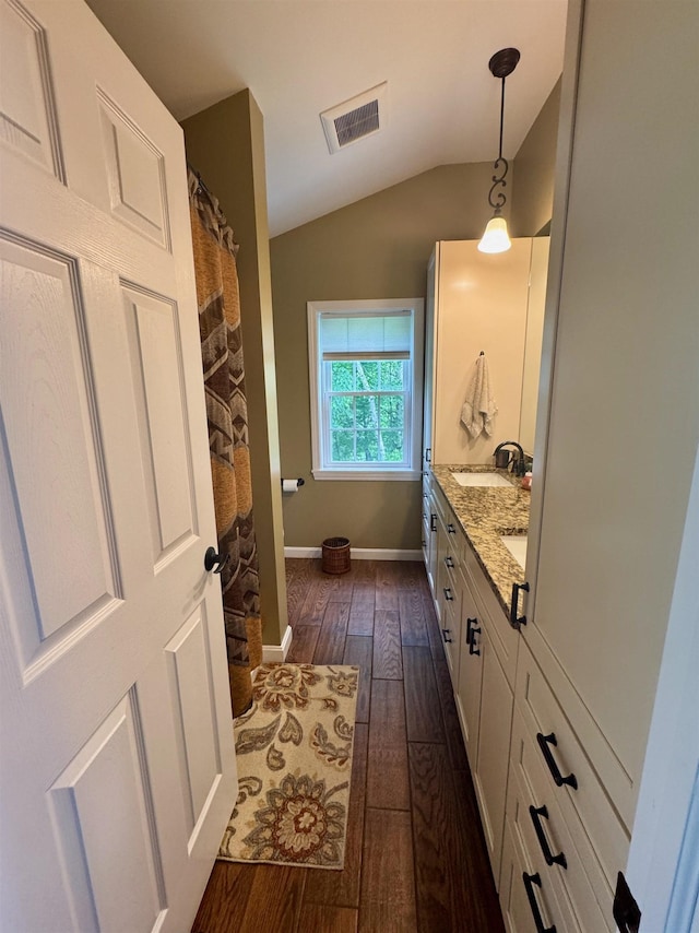 653 Skyboro E Rd, Pownal, VT 05261 - full bath featuring vaulted ceiling, hardwood / wood-style flooring, and double vanity