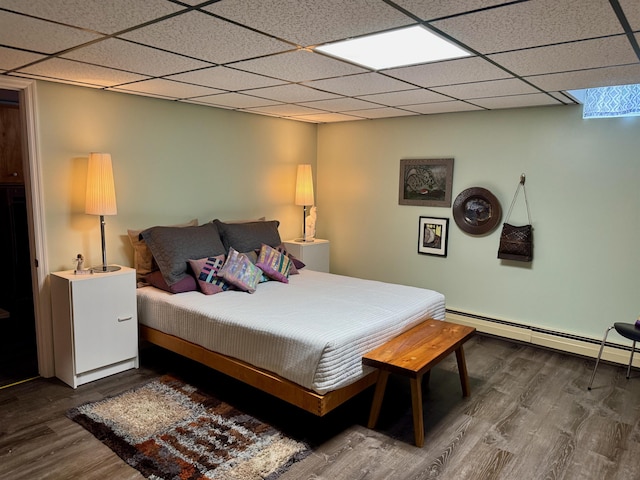 653 Skyboro E Rd, Pownal, VT 05261 - bedroom featuring baseboard heating, wood finished floors, and a drop ceiling
