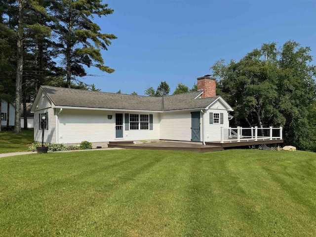 653 Skyboro E Rd, Pownal, VT 05261 - view of front facade featuring a chimney, a front yard, a deck, and roof with shingles