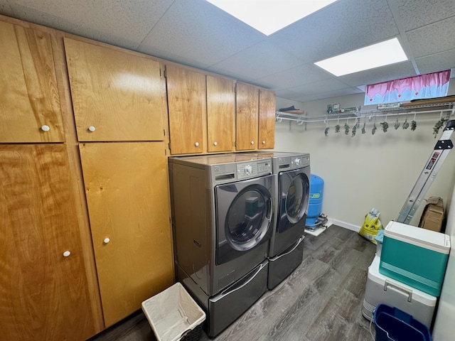 653 Skyboro E Rd, Pownal, VT 05261 - washroom featuring cabinet space, washing machine and dryer, and dark wood-style flooring