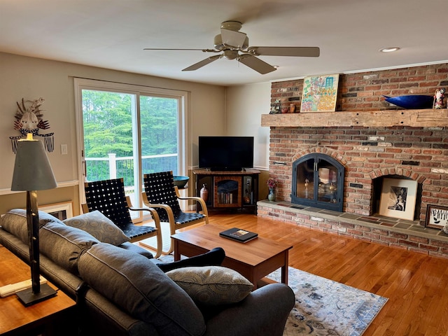 653 Skyboro E Rd, Pownal, VT 05261 - living room featuring ceiling fan, wood finished floors, a brick fireplace, and recessed lighting