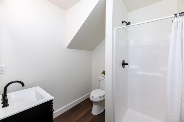 427 Weirs Blvd Unit 3, Laconia, NH 03246 - bathroom featuring wood finished floors, curtained shower, and vanity