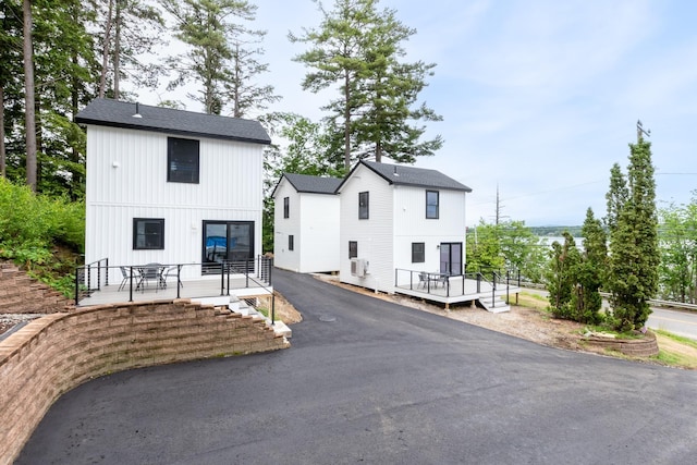 427 Weirs Blvd Unit 3, Laconia, NH 03246 - view of front of house featuring a deck and roof with shingles