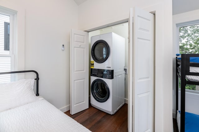 427 Weirs Blvd Unit 3, Laconia, NH 03246 - laundry area with stacked washer and clothes dryer, dark wood finished floors, and healthy amount of natural light