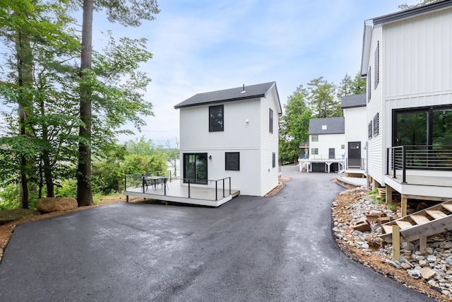 427 Weirs Blvd Unit 3, Laconia, NH 03246 - rear view of house with a deck and board and batten siding