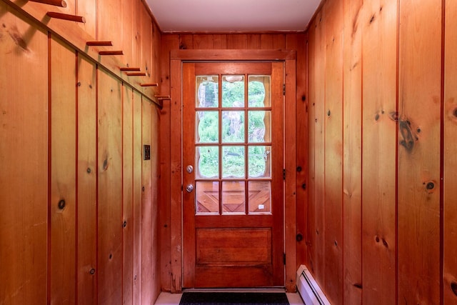 7271 Windham Hill Rd, Windham, VT 05359 - doorway to outside with wooden walls and a baseboard heating unit