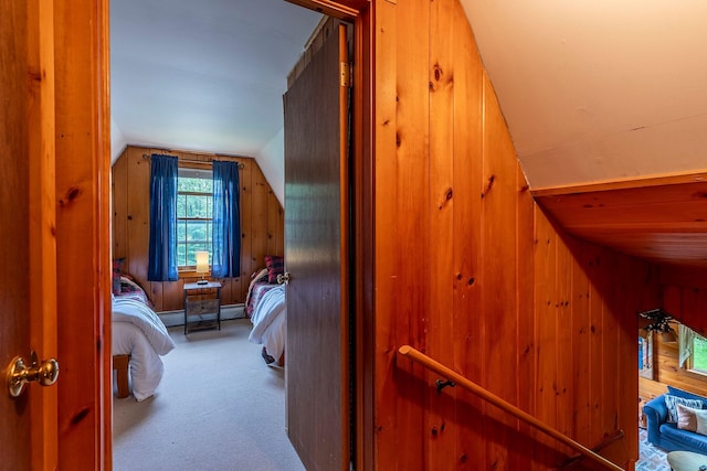 7271 Windham Hill Rd, Windham, VT 05359 - carpeted bedroom with vaulted ceiling, wooden walls, and a baseboard radiator