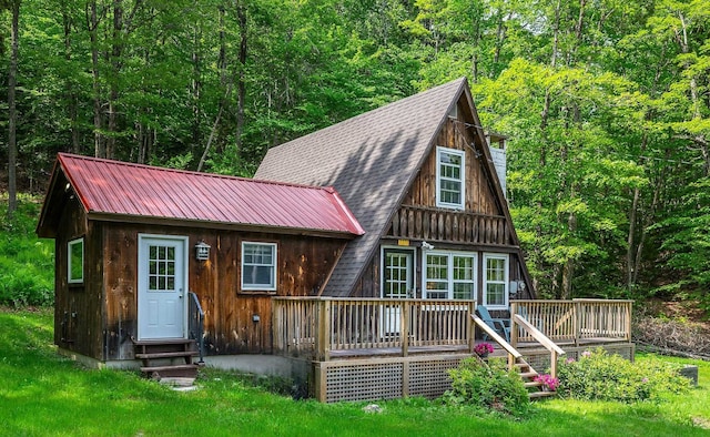 7271 Windham Hill Rd, Windham, VT 05359 - view of front of property with a view of trees, entry steps, a deck, and a metal roof