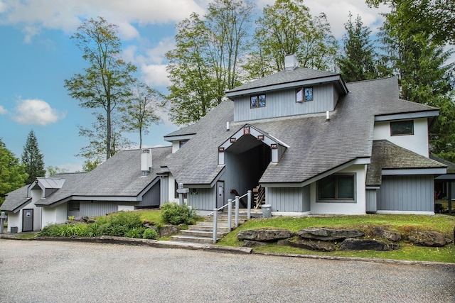 267 Village Cir Unit V-15, Killington, VT 05751 - view of front of home with roof with shingles and a chimney