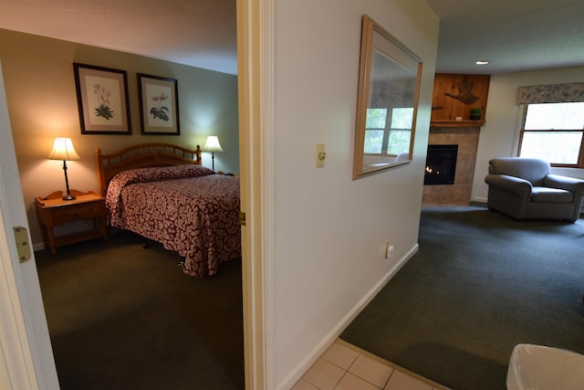 164 Deer Park Dr Unit 173A, Woodstock, NH 03262 - carpeted bedroom featuring a tiled fireplace and recessed lighting