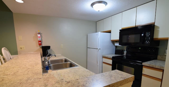 164 Deer Park Dr Unit 173A, Woodstock, NH 03262 - kitchen with black appliances, light countertops, a peninsula, white cabinets, and recessed lighting