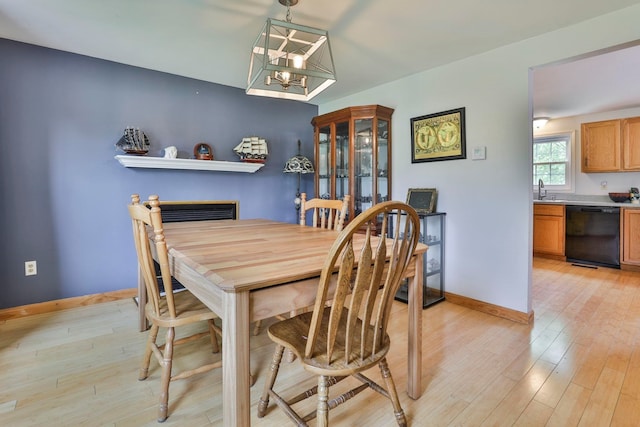 9 Mountain Rd, Goffstown, NH 03045 - dining space with light wood-type flooring and a chandelier