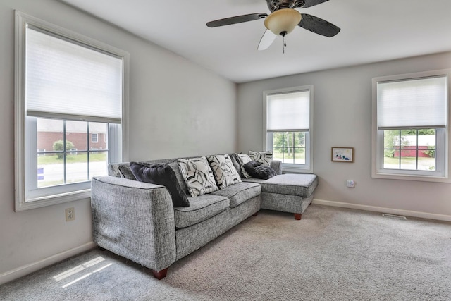 9 Mountain Rd, Goffstown, NH 03045 - carpeted living area with healthy amount of natural light and a ceiling fan