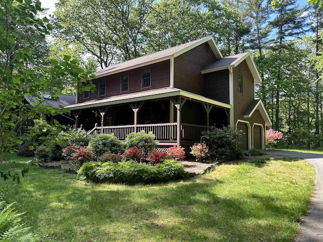 12 Juniper Ridge Rd, Exeter, NH 03833 - view of front of house with covered porch, driveway, and a front yard